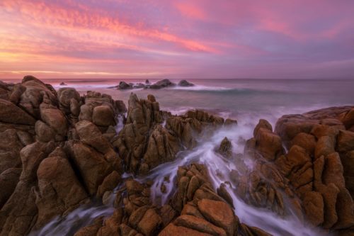 A fiery sunrise at one of many beautiful beaches around St Helens st helens, tasmania