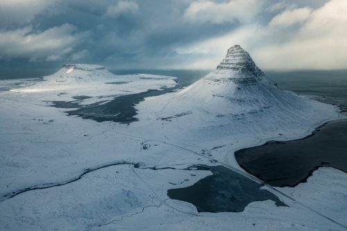 Flying above Kirkjufell in stormy weather Kirkjufell, Iceland