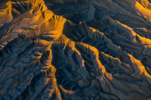 Top down drone view of the Utah badlands at sunrise Utah, badlands, drone