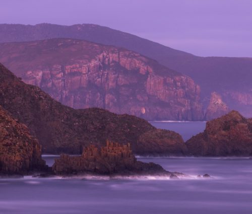 The majestic sea cliffs of Bruny Island glowing at sunset Bruny island, Tasmania