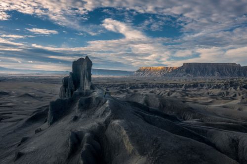 A figure gives scale to the vastness of the Utah badlands Utah, badlands
