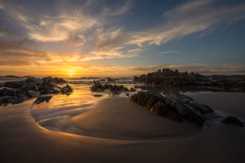 Sunset at a scene typical of the Tarkine coast with jagged coloured rocks Tarkine wilderness, Tasmania, Sarah Anne Rocks