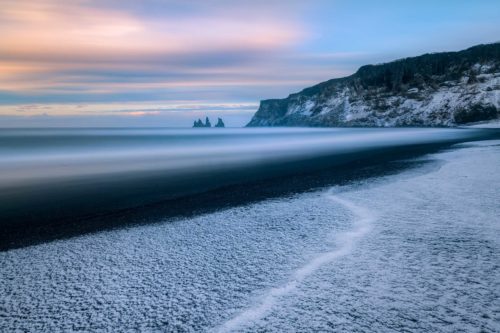 One of those rare calm days at Vik with a layer of fresh snow Vik, Iceland