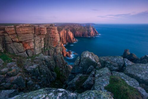 Sunset after glow on the cliffs of Land's End Land's End