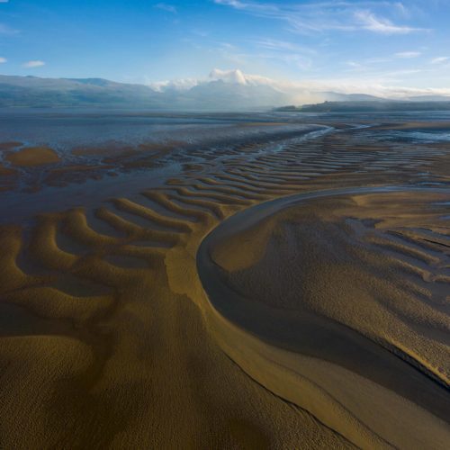 Sand patterns off the Welsh coast of Anglesey also known as Holy Island Wales, Anglesey