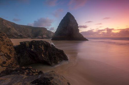 Sunset at the massive shark tooth rock stack of Bedruthan Steps Bedruthan Steps, Cornwall