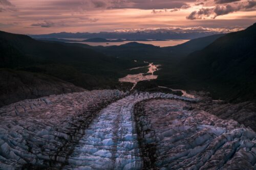 The path of a glacier in Alaska towards a bay Boundary range, Alaska, mountains, aerial