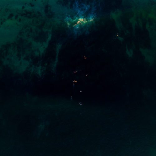 Waves and surfers catching the last light of the day in Injidup Injidup, Yallingup, surfers, surfing, Western Australia