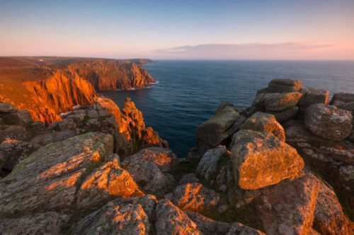 Sunset light on the cliffs of Land's End Land's End, Cornwall