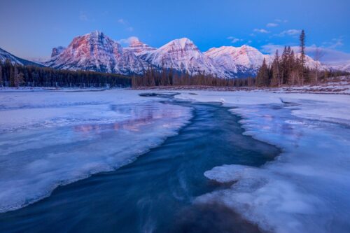 Predawn glow on the Canadian Rockies shooting from some rather thin ice Canadian Rockies, icefield parkway, Canada, Jasper National Park
