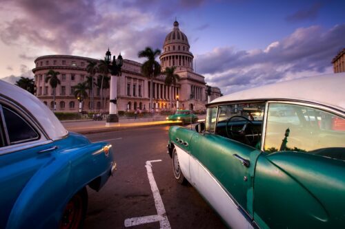 Sunset traffic around the icon of Havana, the Capitolio Cuba, Havana, Capitolio, Chevy