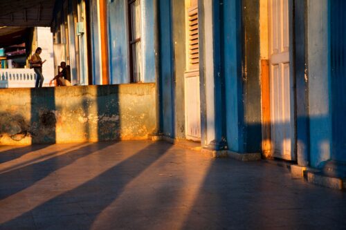 Little local exchange framed by the typical porches of Vinales homes Vinales, Cuba