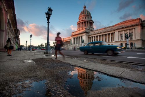 The city of Havana starts to come alive at sunrise in front of the iconic Capitolio building Havana, Capitolio, Cuba