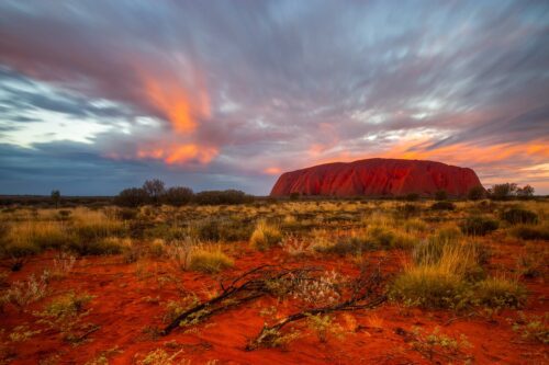 A fiery sunset and piece of rainbow at Uluru Uluru, Kata tjuta, Northern Territory, Australia