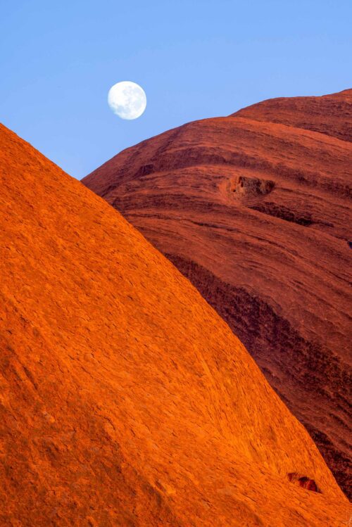 Morning light on Uluru from a telephoto perspective moon, Uluru, Kata Tjuta NP, Northern Territory, Australia