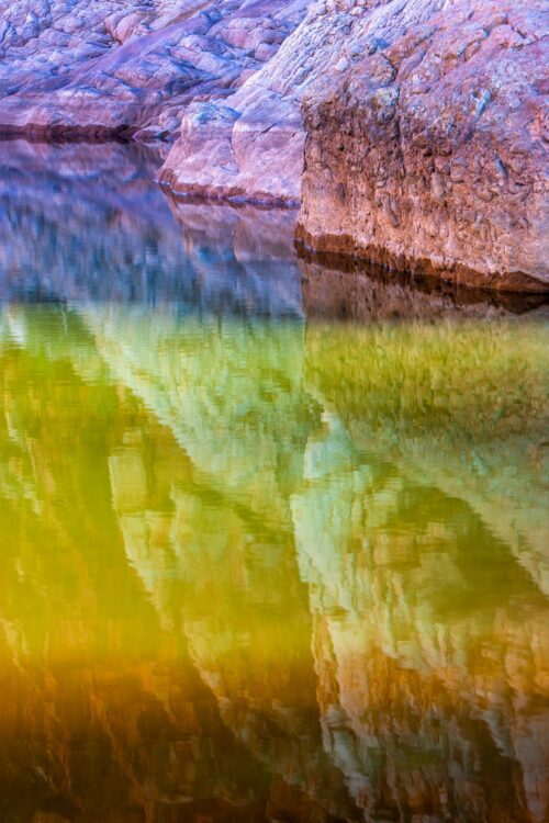 Some late afternoon light interacting with the rocks and water of Glen Helen gorge Glen Helen gorge, Northern Territory