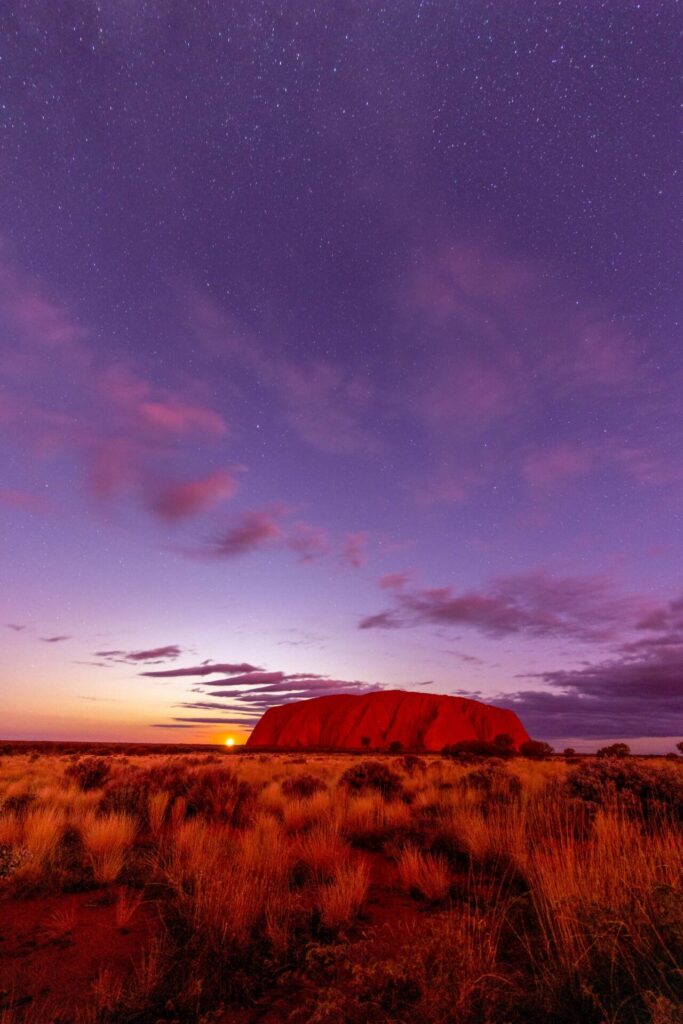 Moonrise and the peak of sunset afterglow on Uluru Uluru, sunrise, Northern Territory, stars