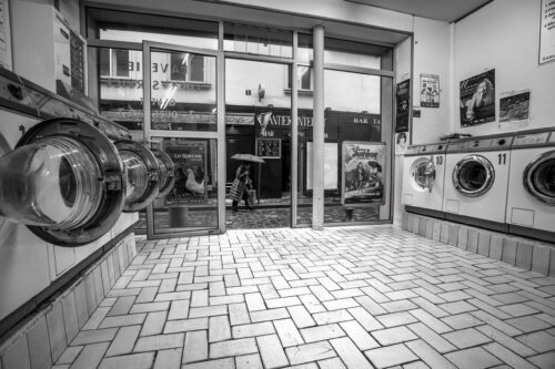 Laundrette looking out to Rue de Lappe in Bastille Bastille, laundrette, Paris, black and white