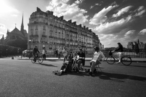 Pont de Sully is often a hub of activity in Paris with buskers often frequenting it Pont de Sully, musicians, Paris, black and white