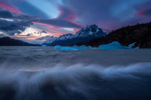 Windswell on the glacier fed Lago Grey with lenticular clouds at sunset Lago grey, Torres del Paine, Chile, Patagonia