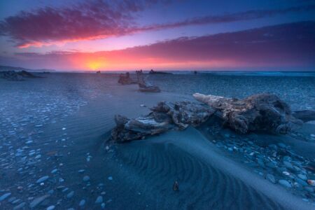 Sand patterns and driftwood on the west coast west coast, Gillespie's beach, New Zealand, driftwood