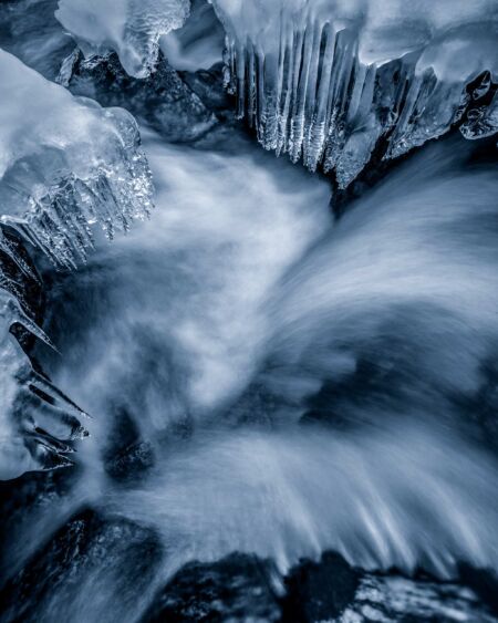 Flowing water and icicles at Stetind Stetind, Norway