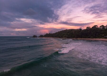 Surfers enjoying a sunset session at the Pass and Clarke's Beach in Byron Bay surfers, Byron Bay, Clarke's Beach, The Pass, New South Wales