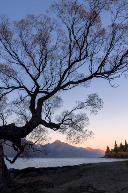 A pristine autumn sunrise by the shores of Lake Wakatipu in Queenstown Autumn, Wakatipu, Queenstown, New Zealand