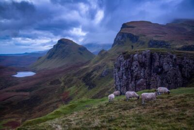 A photographer gives scale to the grandeur of the Quiraing on the Isle of Skye Quiraing, isle of Skye, Scotland